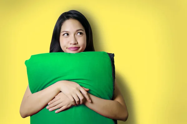 Asian lady hug pillow imagine on background — Stock Photo, Image