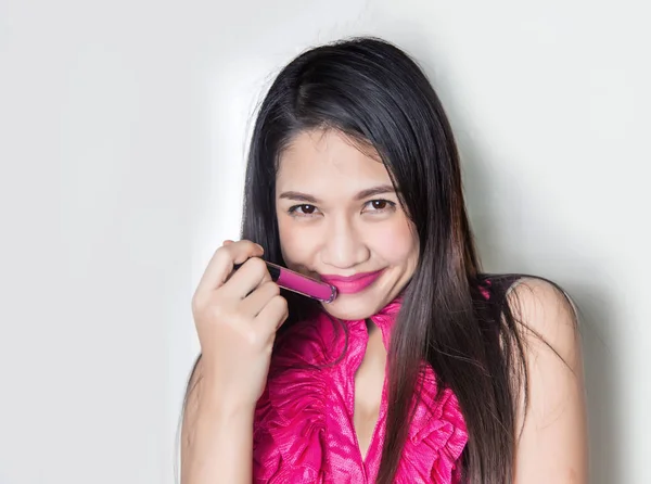 Cute asian lady smile with pink lipstick on studio shot. — Stock Photo, Image