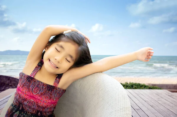 Asian kid waking from lrelax day on sofa — Stock Photo, Image