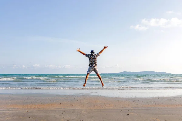 happy man freedom jump ocean sea scape background