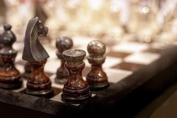 Close-up of chess game and chess pieces on table 4k from Pikwizard