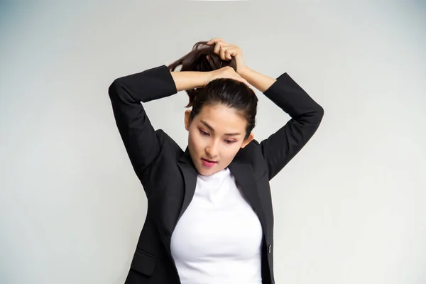 asian business girl grab pony tail hair as ready to working on white background