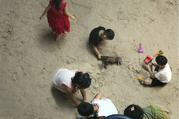 kids always love to play sand with toy in outdoor activities anf use mask in pandemic situation.