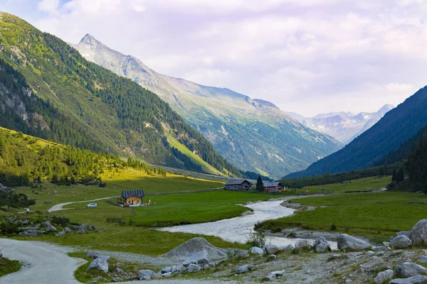 Alpine landscape. High mountain alpine valley at summer.   Tourist route Krimml Waterfalls - Krimmler Tauernhaus. Hohe Tauern National Park. Austria. Famous tourism destination, tourist attraction