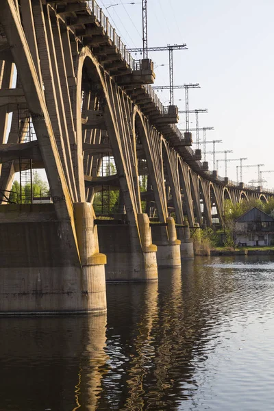 Old  arched monolithic concret railway bridge close-up