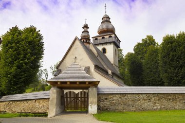 Old Gothic Catholic church outdoors,  village Smrecany, Liptov. clipart