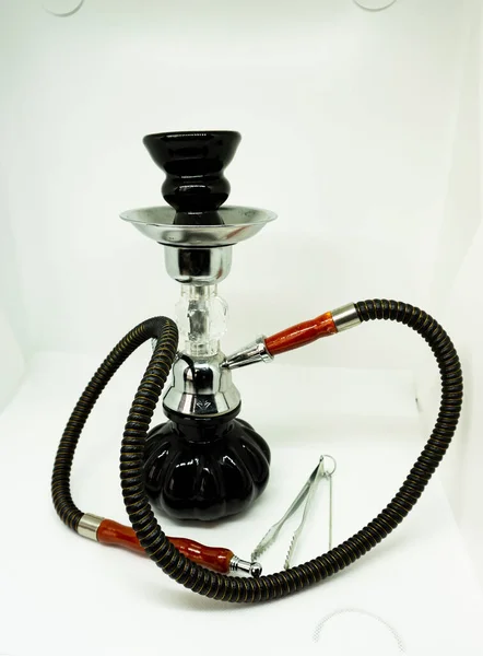 small black hookah with charcoal tongs