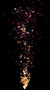 Canlı renkli yıldız parçacıkları izole edilmiş siyah ekran arka planda parıldıyor ve yüzüyor. Kutlamalar, partiler, festivaller ve görsel efektler için mükemmel..