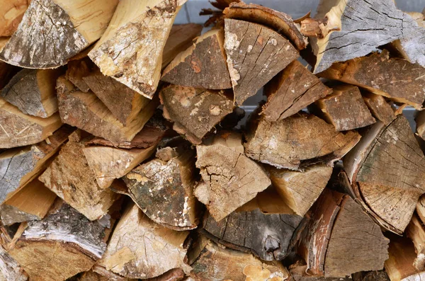 Abstract photograph of piles of natural wooden logs. Background. Harvesting firewood for the winter. Texture. Wood for the fireplace. Birch boards. Macrosymka. Copy space — Stock Image Abstract photograph of piles of natural wooden logs. Background. Harvesting firewood for the winter. Texture. Wood for the fireplace. Birch boards. Macrosymka. Copy space Stock Image