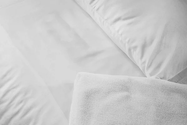 White towel on white mattress fabric, soft light in the morning — Stock Photo, Image