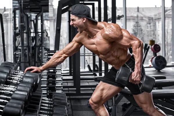 Gespierde Man Trainen Sportschool Doen Oefeningen Voor Rug Enkele Arm — Stockfoto