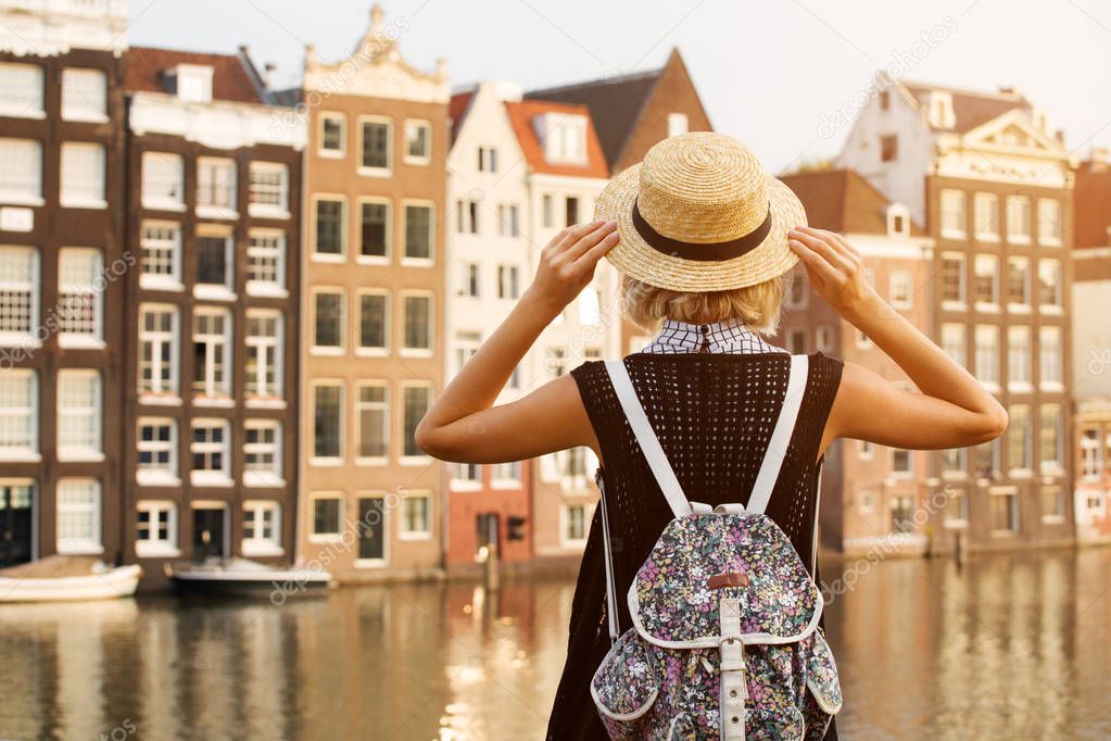 Travel in Amsterdam. Beautiful woman on vacation in Amsterdam city