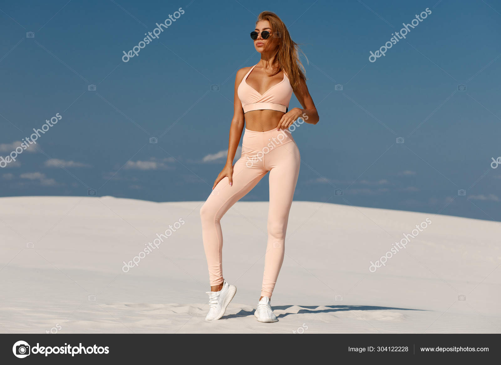 Beautiful fitness woman outdoors. Athletic girl in leggings Stock Photo