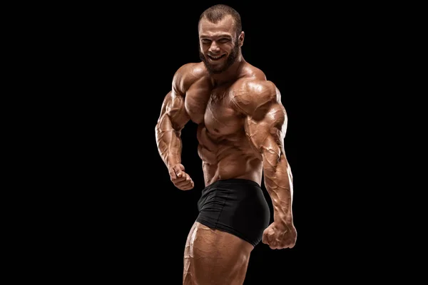 筋肉を示す筋肉の男 黒い背景に隔離 ボディービルダー男性裸胴体腹筋 — ストック写真