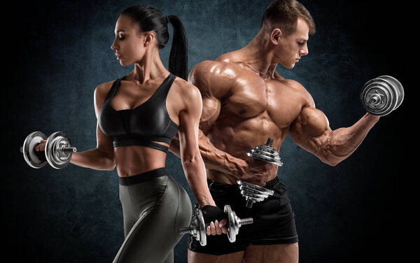 Sporty couple workout with dumbbells. Muscular man and woman showing muscles