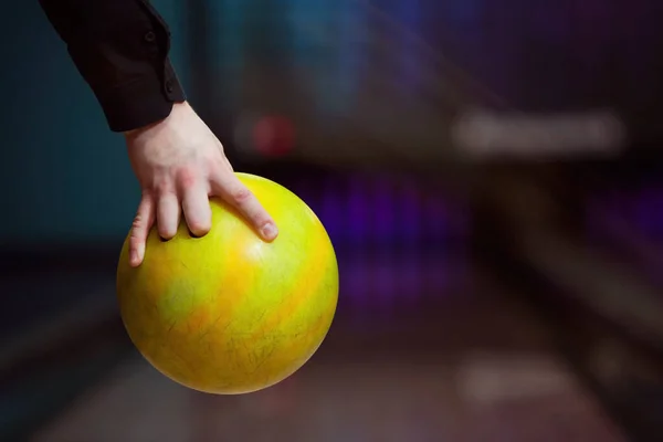 Stock image Man holding ball against bowling alley