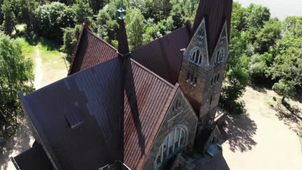 Old nice catholic church. on the shore of lake or sea. Primorsk Koivisto, aerial — Stock Video