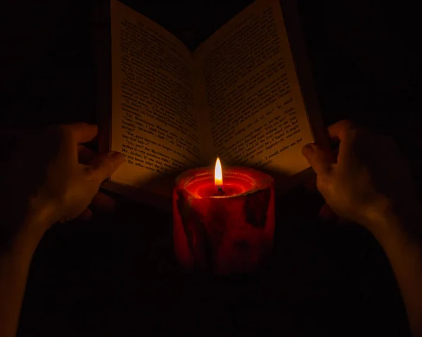 Reading Book Candlelight Stock Image