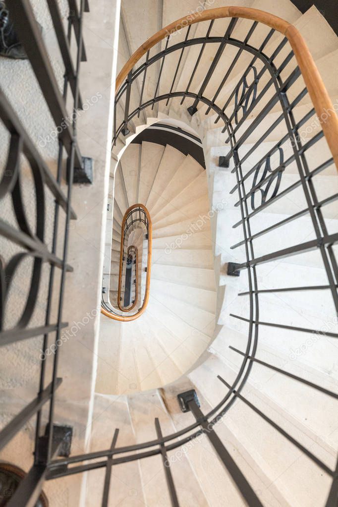 High angle view of spiral staircase winding downward