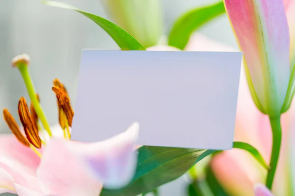 Blank business card in flower bouquet