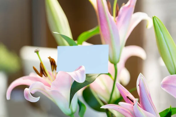 Blank business card in flower bouquet