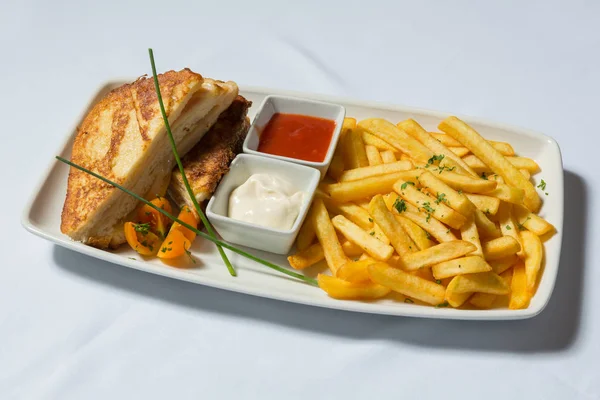 Club sandwich served on plate with french fries — Stock Photo, Image