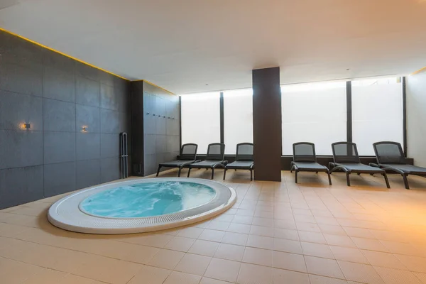 Hydromassage bath in hotel wellness center