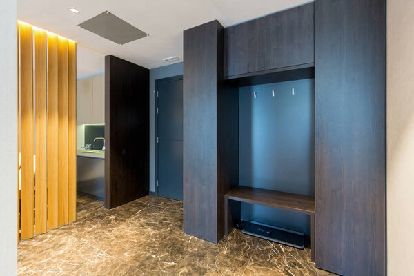 Hotel room interior, entrance area with marble floor