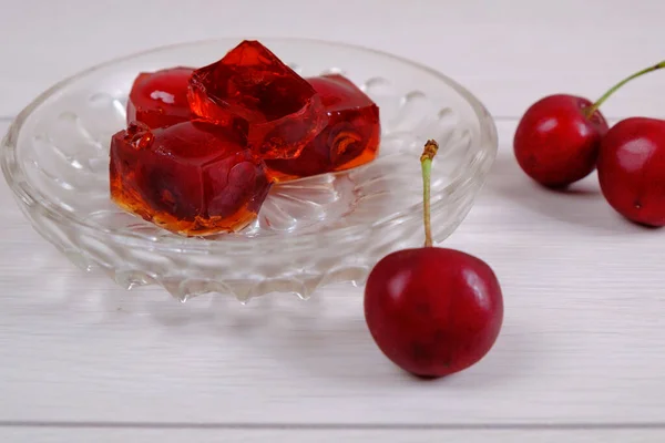 Red cherry jelly on a white background