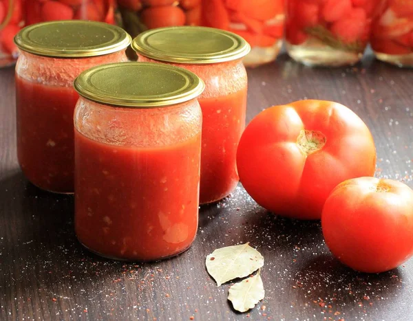 Canned tomatoes for the winter in banks. Tomato salads with vinegar.