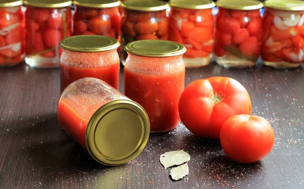 Canned tomatoes for the winter in banks. Tomato salads with vinegar.