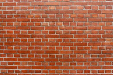 Duvarın arka planında kahverengi renkli doğal kil tuğla deseni