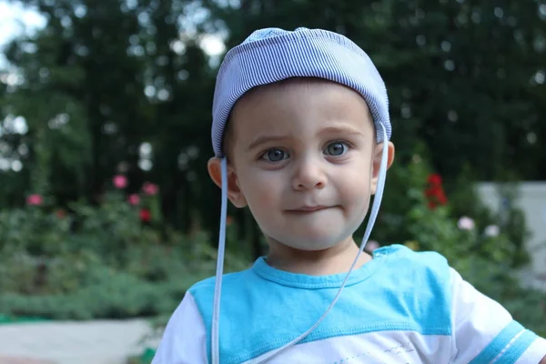 Cute Little Blonde Boy Walks Outdoors Park Blue Hat — 图库照片