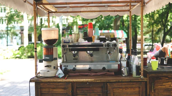 Mobile coffee counter with coffee machine in park