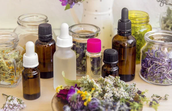Lot Different Aromatherpy Oil Bottles Table Decorated Wild Dried Flowers — Stock Photo, Image