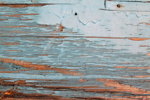 eski mavi kurulu kırık boya, vintage ahşap arka plan, grunge tahta ile. Eski ahşap arka plan ağaç eski boya artıkları parçaları kalıntıları ile. Doku eski ağaç bir kurulu ile boya, antika arka plan boya soyulmuştu. eski mavi kurulu SRA ile