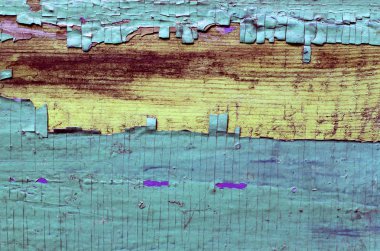Ahşap üzerinde eski boya kalıntıları olan eski ahşap bir arka plan. Eski bir ağacın dokusu, boyalı bir tahta, eski model arka plan soyma boyası. Kırık boyalı eski mavi tahta, eski model