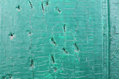 Ahşap üzerinde eski boya kalıntıları olan eski ahşap bir arka plan. Eski bir ağacın dokusu, eski bir ahşap arka plan soyma boyası. Kırık boyalı eski mavi tahta