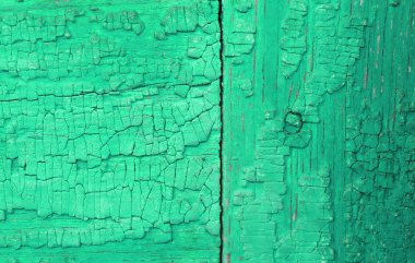 Ahşap üzerinde eski boya kalıntıları olan eski ahşap bir arka plan. Eski bir ağacın dokusu, eski bir ahşap arka plan soyma boyası. Kırık boyalı eski mavi tahta