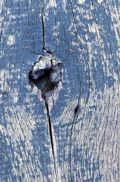 Antiguo fondo de madera con restos de pedazos de pintura vieja sobre madera. Textura de un árbol viejo, pintura de pelado de fondo de madera vintage. viejo tablero azul con pintura agrietada — Foto de Stock