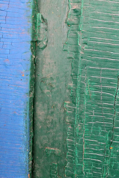 Fundo de madeira velho com restos de pedaços de restos de tinta velha em madeira. Textura de uma árvore velha, pintura de descascamento de fundo de madeira vintage. placa azul velha com tinta rachada — Fotografia de Stock