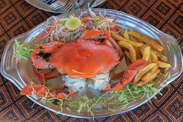 Big crabs and vegetable in beach restaurant, GOA, India.