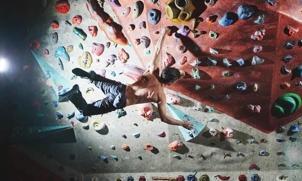 man climber climbs indoors