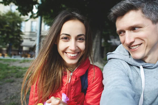 happy young couple making funny selfies