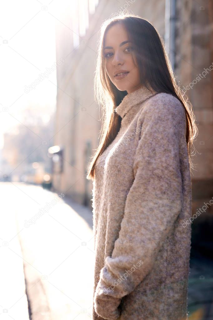 beautiful woman standing on the street