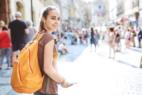 stock image a woman tourist in the center of Prague with a phone in the hands of