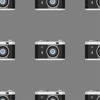 Gri arkaplandaki fotoğraf için düz siyah kamera. Kusursuz stil iş teknolojisi modeli.