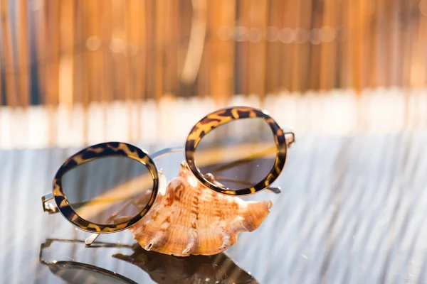 Cat eye sunglasses special model for ladies stay on table in a summer day. Selective focus