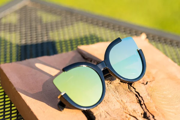 Cat eye sunglasses design model for women shoot outside closeup. Selective focus