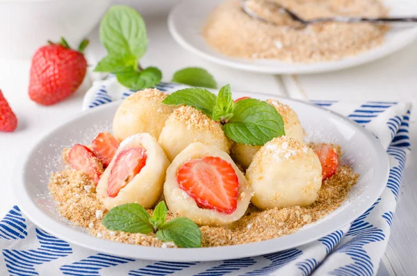 Stuffed strawberry dumplings, delish dessert with herbs, food photography